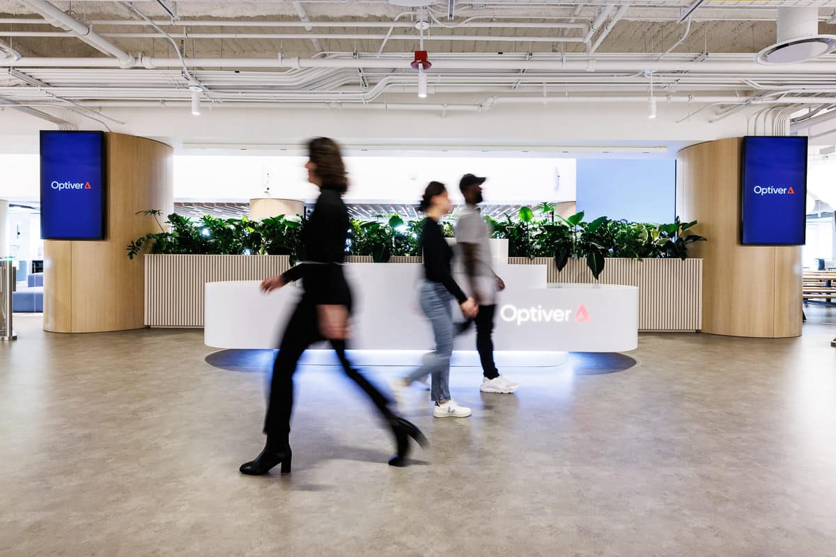 Chicago corporate photographer Tori Soper captures employees walking though an office