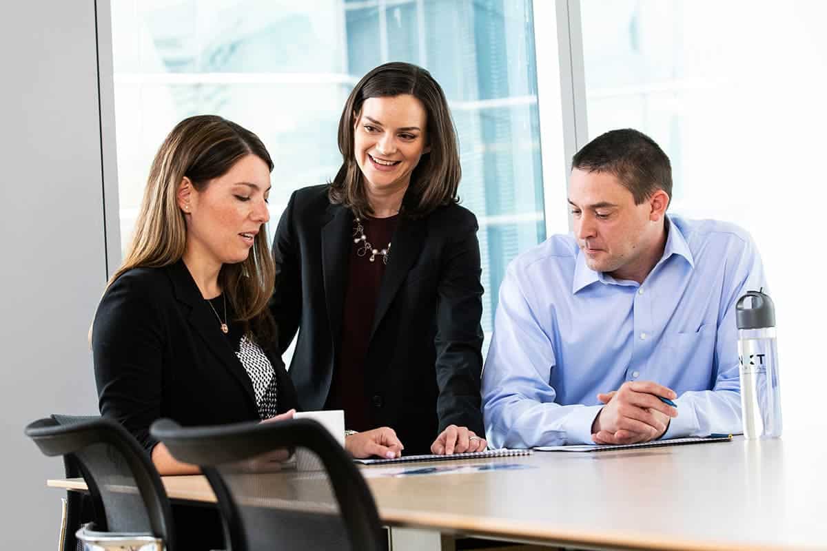 A group of business people meeting during a corporate photography session in Chicago.