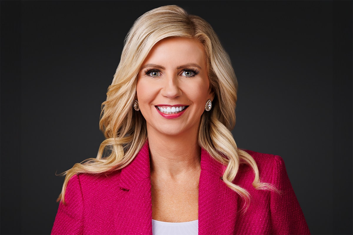 Confident business headshot taken at a Chicago Headshot Lounge during a corporate event.