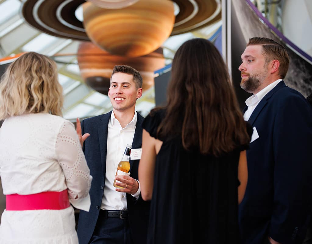 Guests networking during a Chicago corporate event reception, photographed by Chicago corporate event photographer Tori Soper.