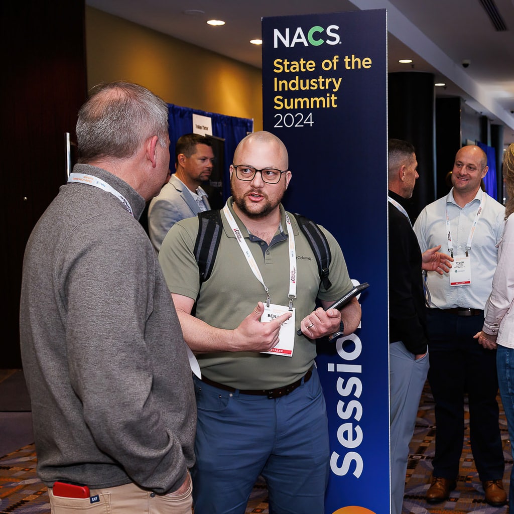 Attendees networking and conversing at a conference, photographed by Chicago corporate event photographer Tori Soper.