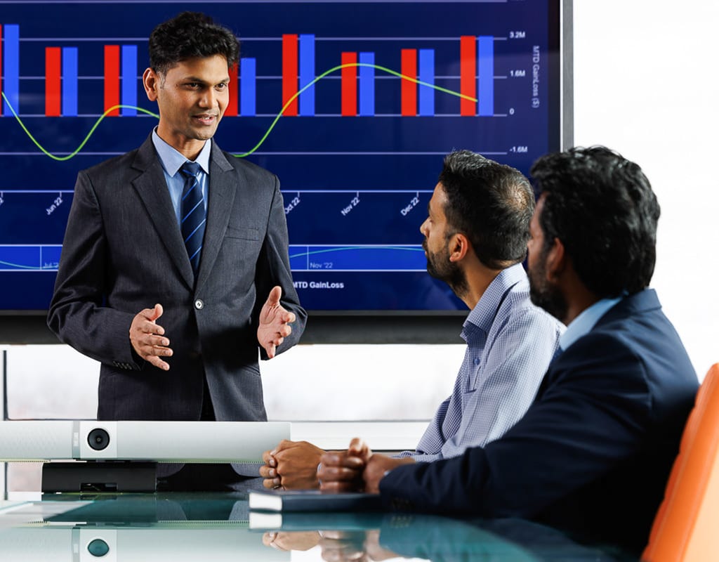 Business leaders discussing strategy during a presentation, Chicago Business Photography for corporate storytelling.