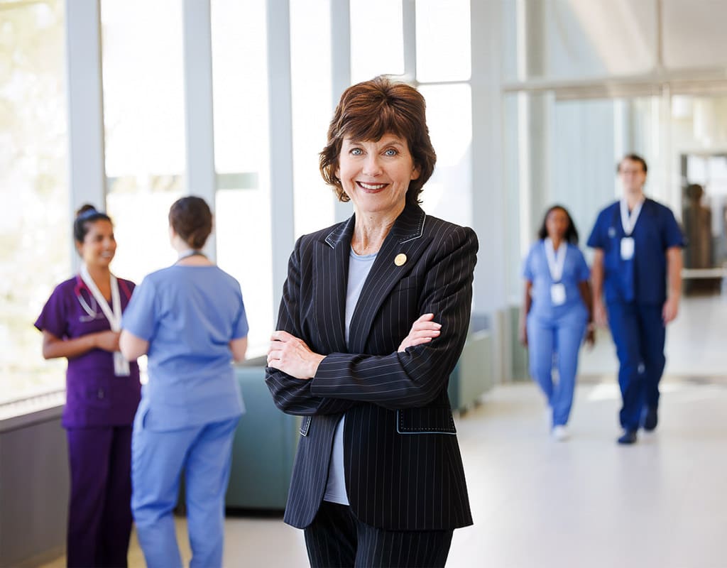 Confident professional standing in a corporate setting, Chicago Business Photography emphasizing leadership and branding.
