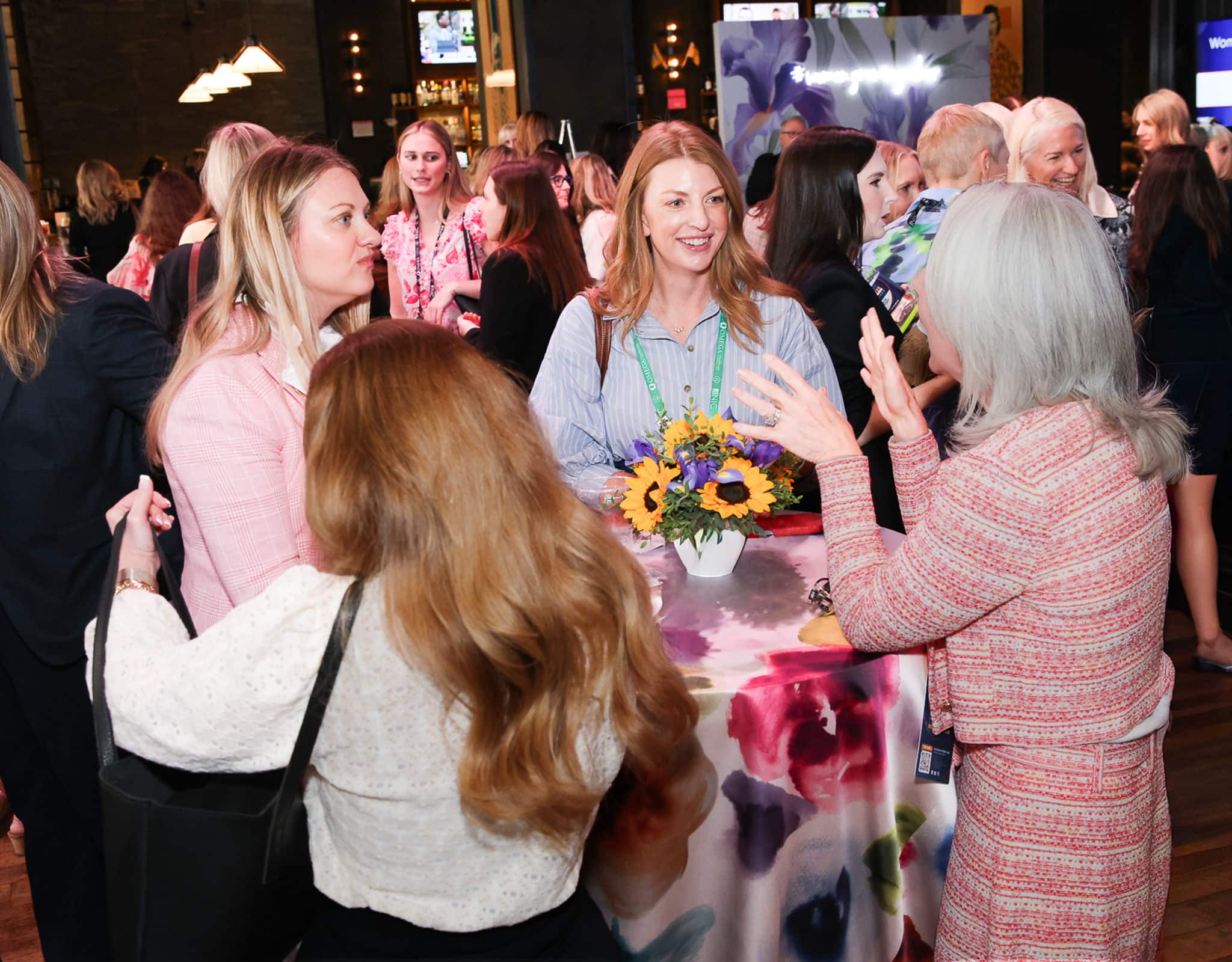 Conference attendees networking at Chicago women's event