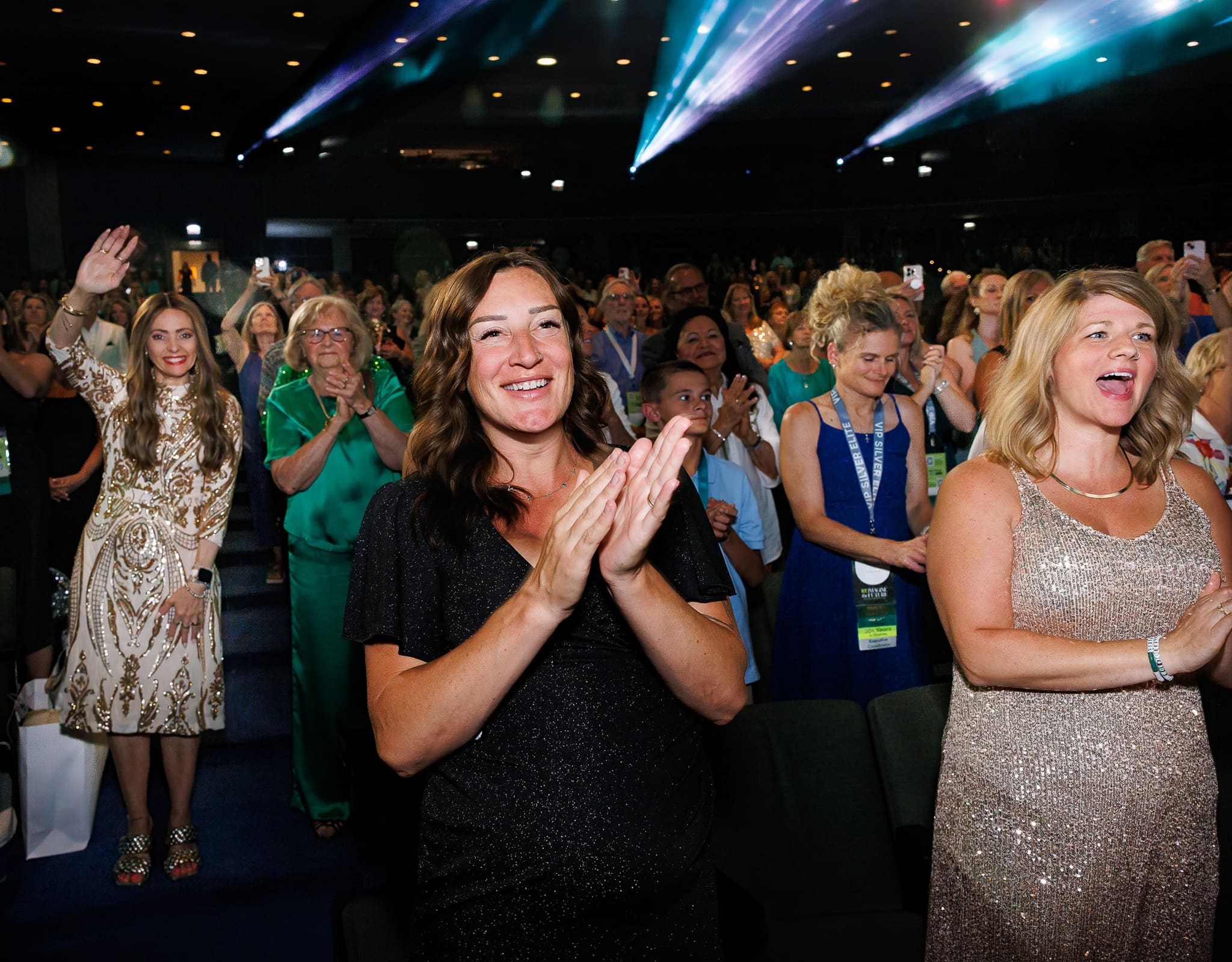 Chicago corporate event photography of attendees applauding during a conference session