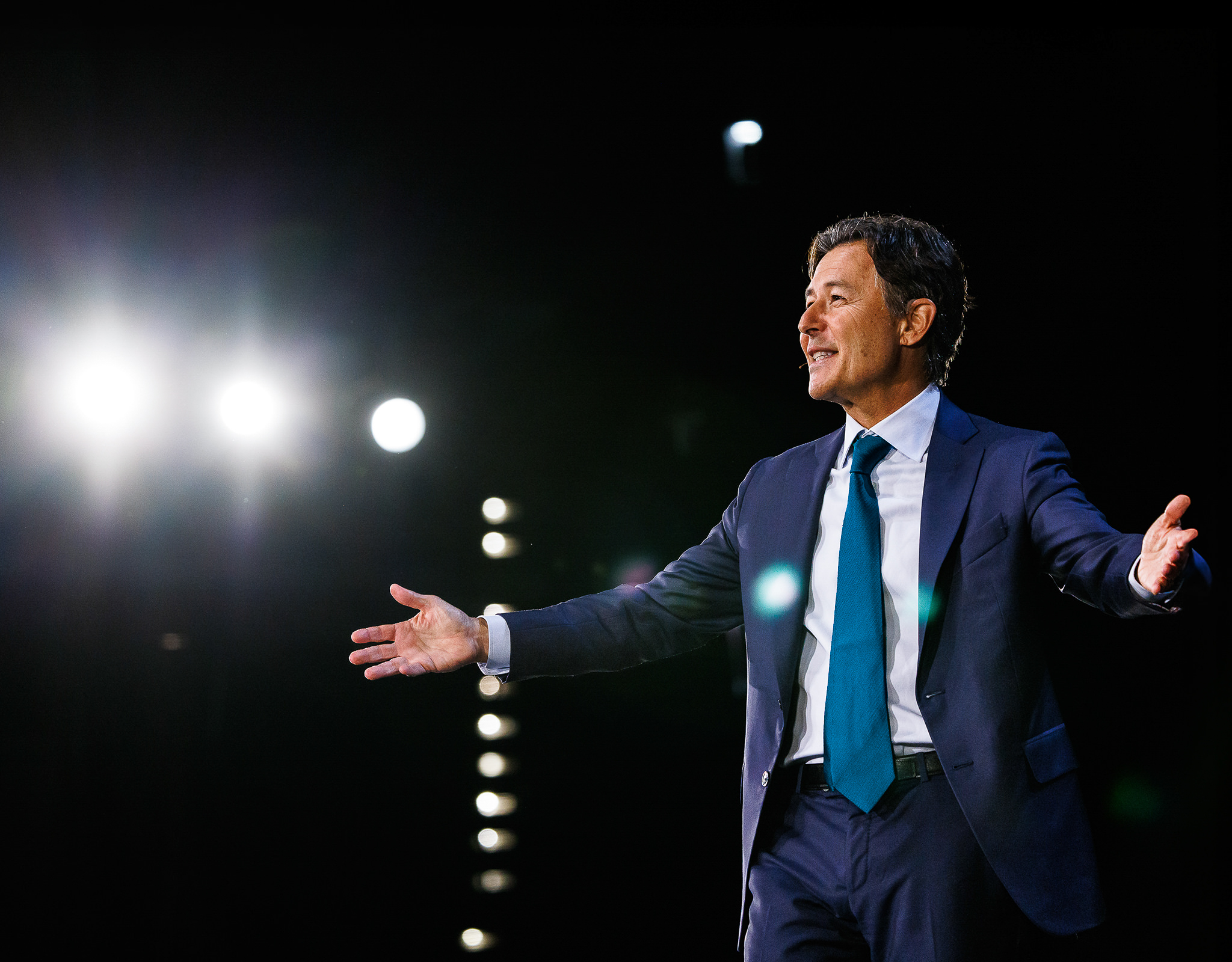 Chicago corporate event photography capturing keynote speaker on stage under dramatic lighting