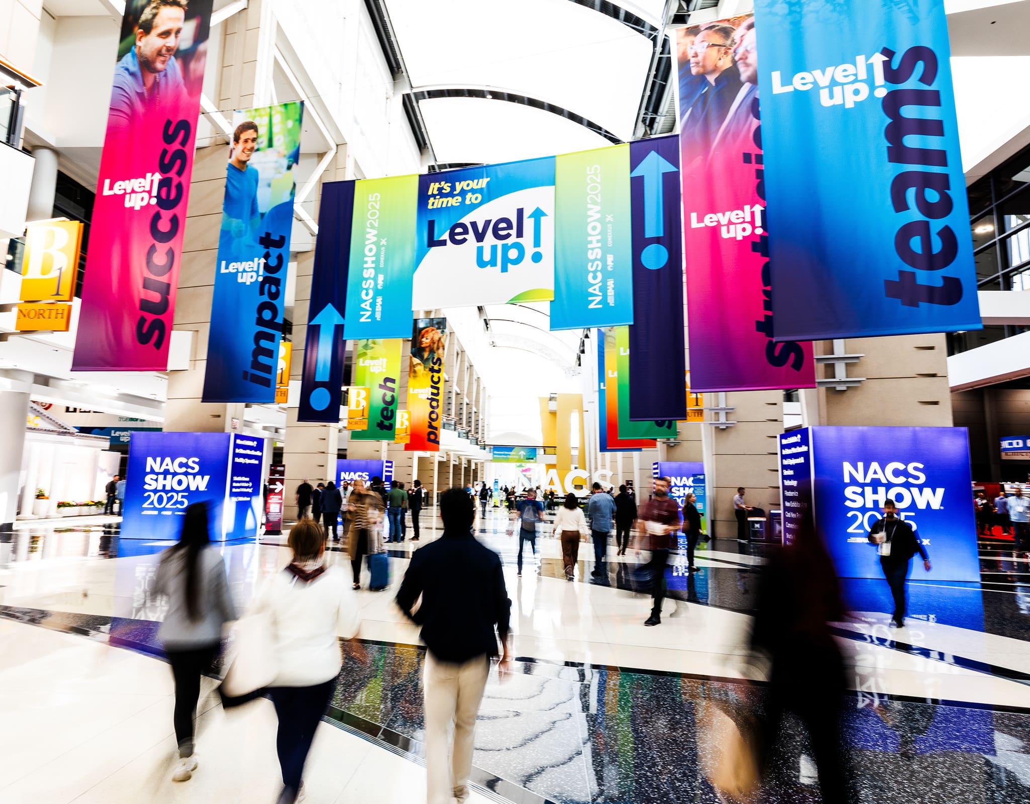 Chicago corporate event photography capturing busy trade show floor with attendees, branding signage, and expo environment