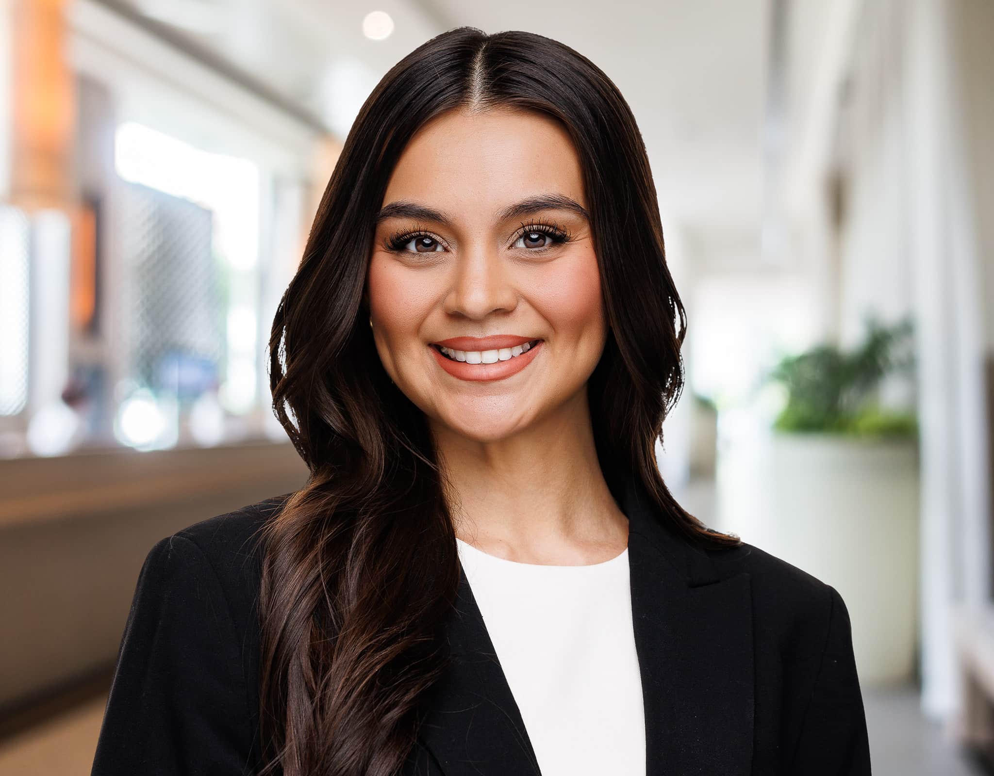 Professional woman photographed in bright office setting for Chicago corporate headshots