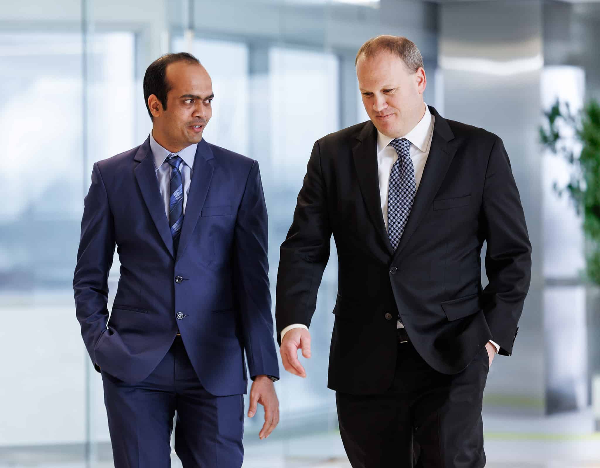 Chicago corporate photography of business executives walking together in a downtown office setting