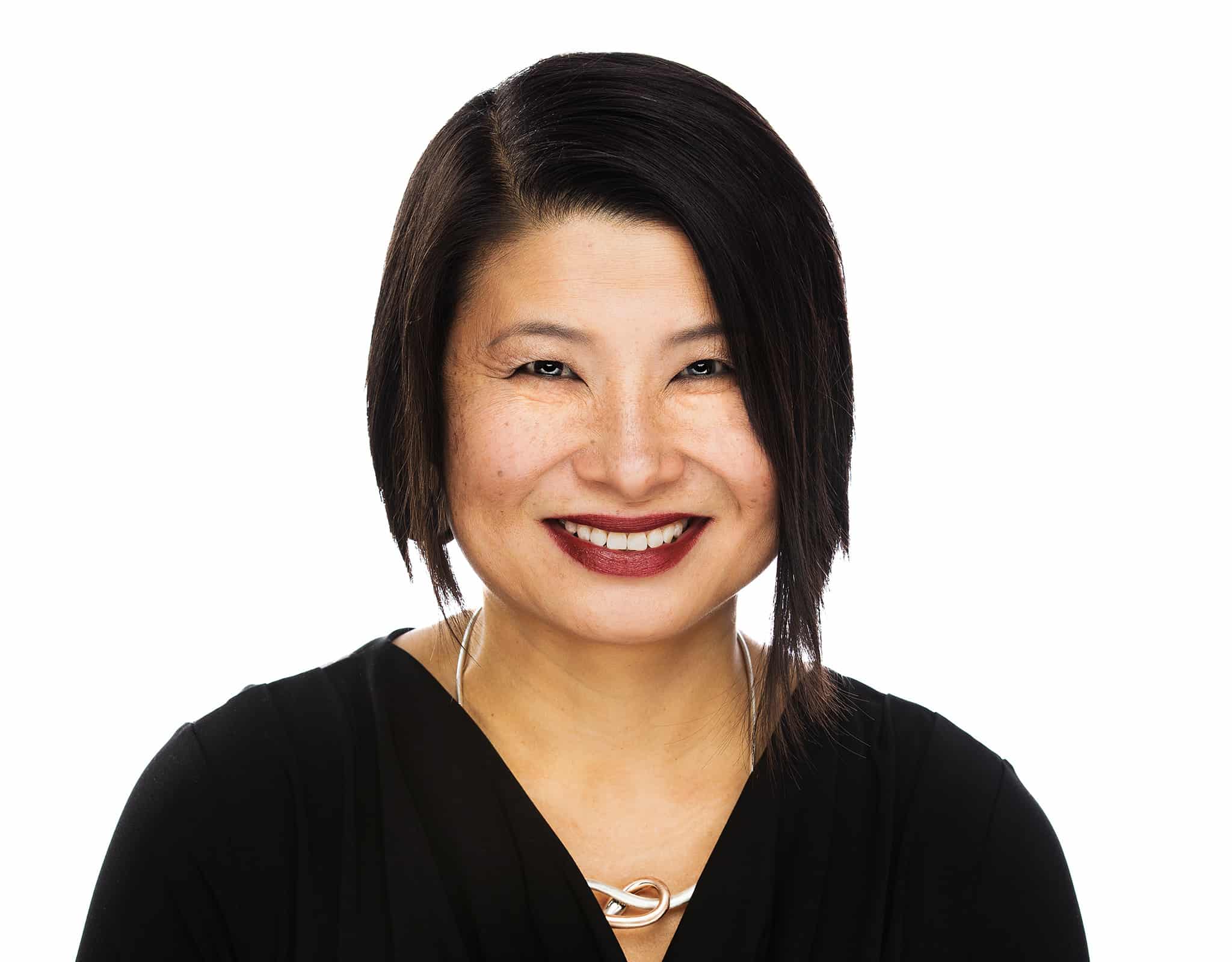 Chicago corporate headshot of executive with confident expression on studio background