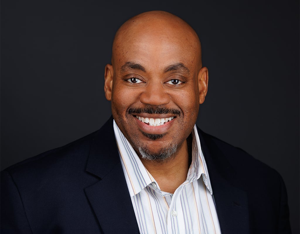 Professional business headshot taken at a Chicago Headshot Lounge during a corporate event.