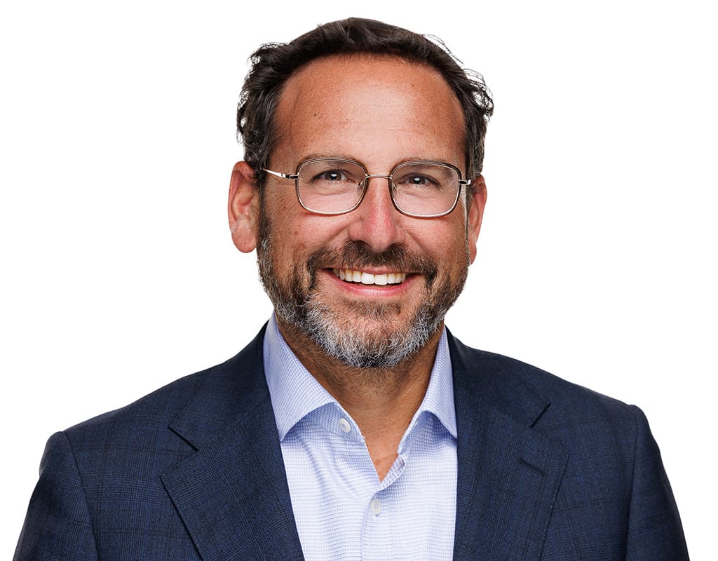 Smiling executive headshot captured at a Chicago Headshot Lounge at a conference.