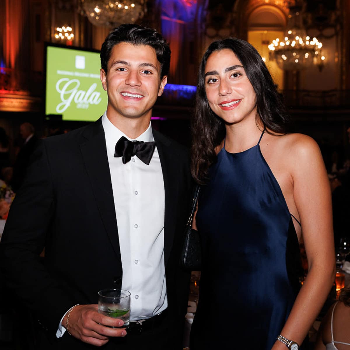 A couple poses for a photo at a Chicago corporate gala