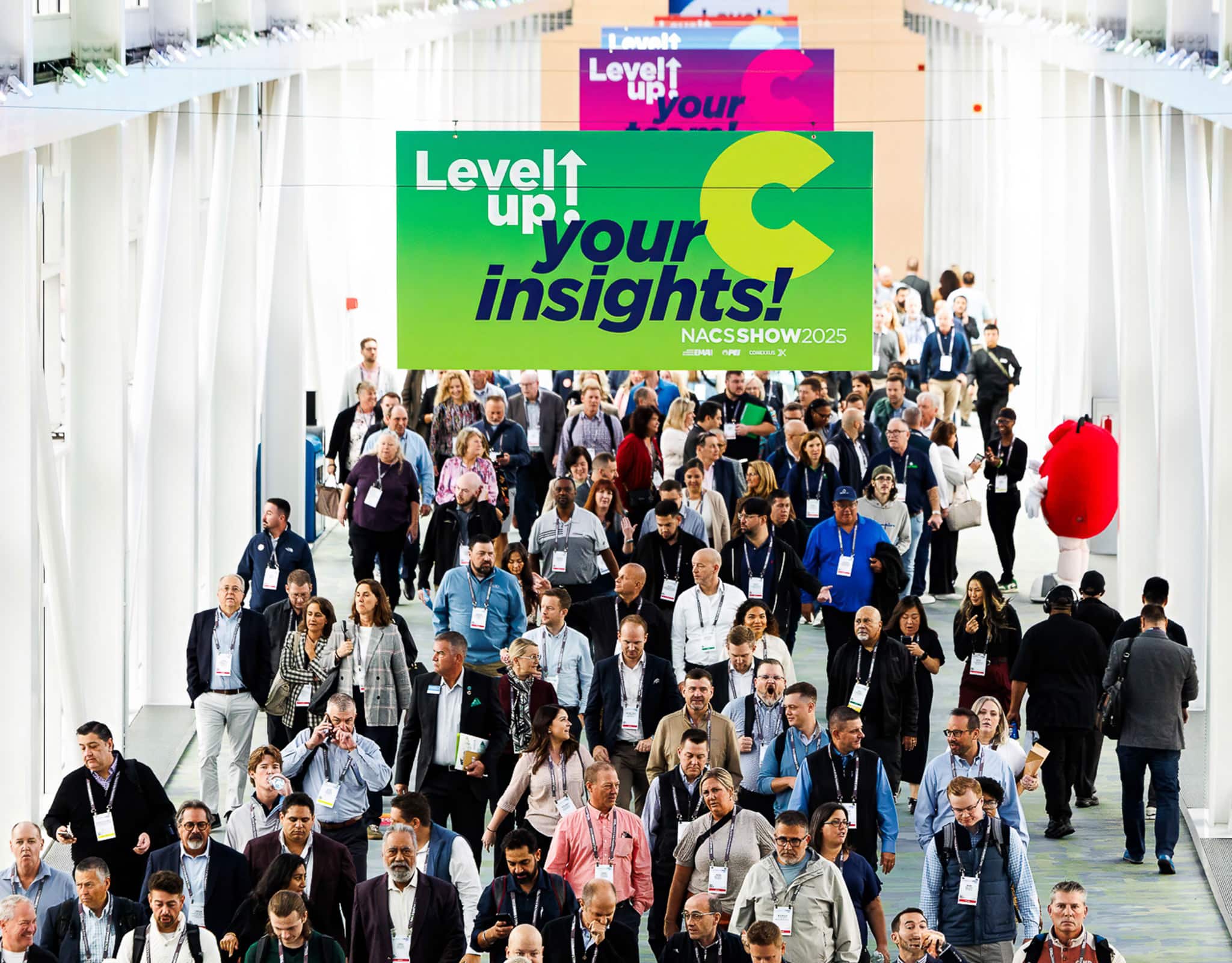 Chicago corporate event photographer capturing large conference crowd during general session.