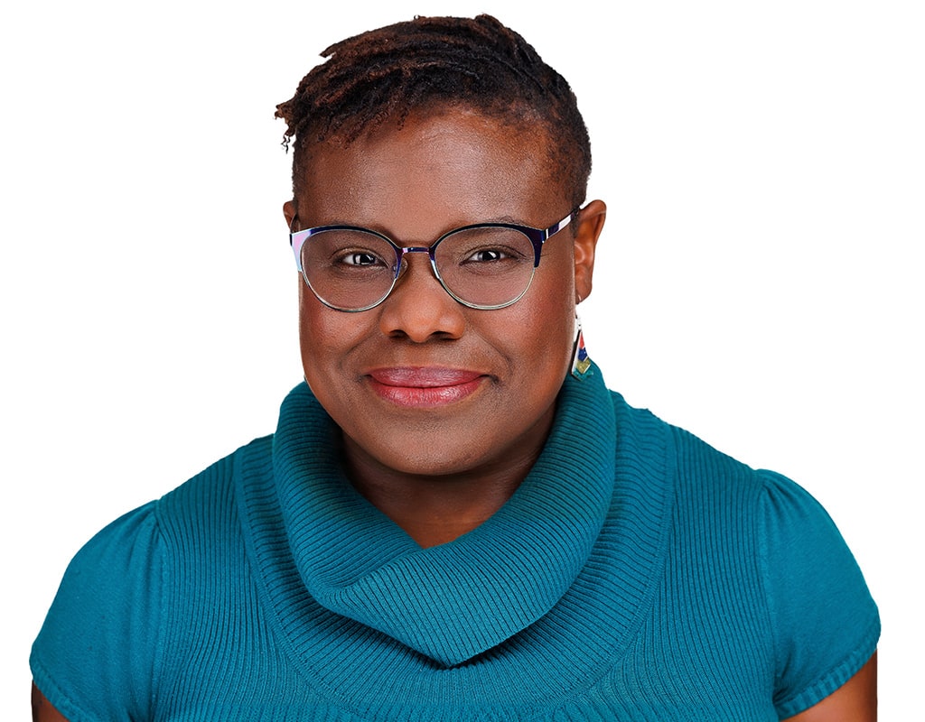 Business headshot of a woman in a teal sweater, Chicago corporate headshots by Tori Soper Photography.