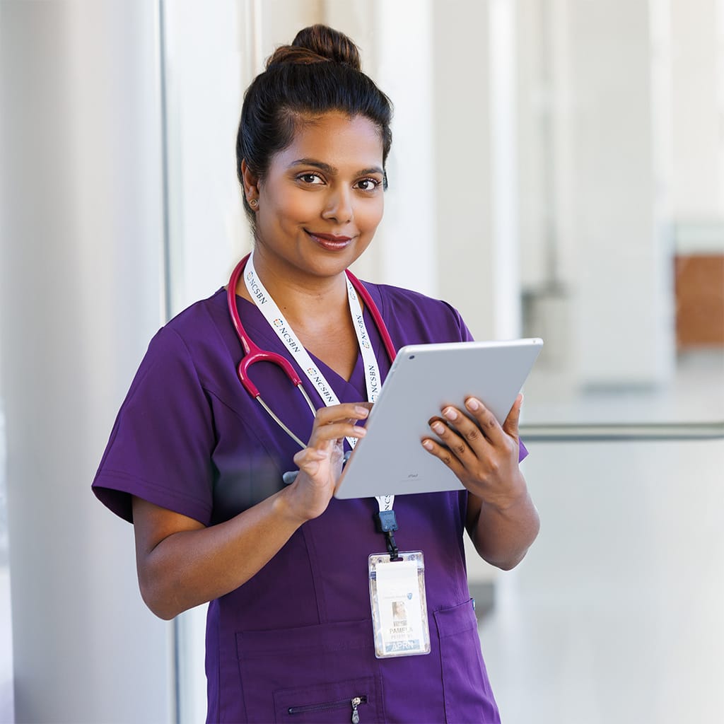 Corporate lifestyle photography of a nurse reviewing information in a healthcare setting