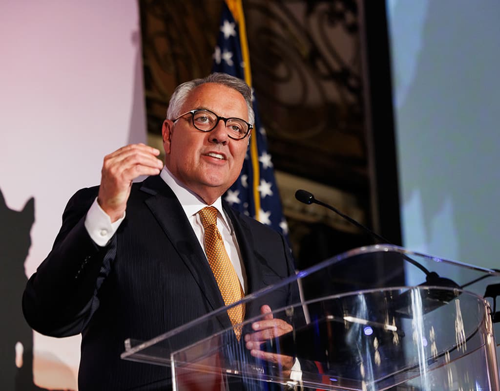 Executive speaker presenting at a corporate gala, photographed by Chicago corporate event photographer Tori Soper.