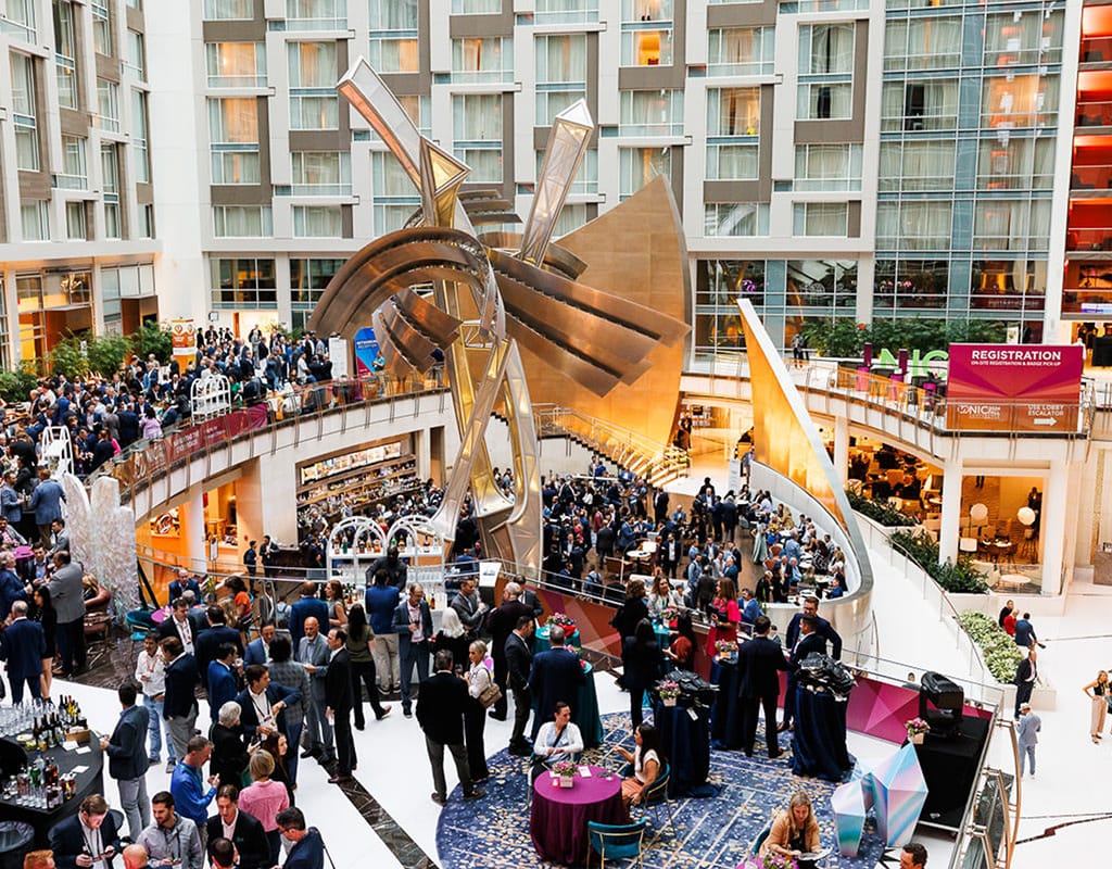 Attendees arriving at a bustling Chicago conference, photographed by Chicago corporate event photographer Tori Soper. Attendees networking at a corporate conference in Chicago, photographed by Chicago corporate event photographer Tori Soper.