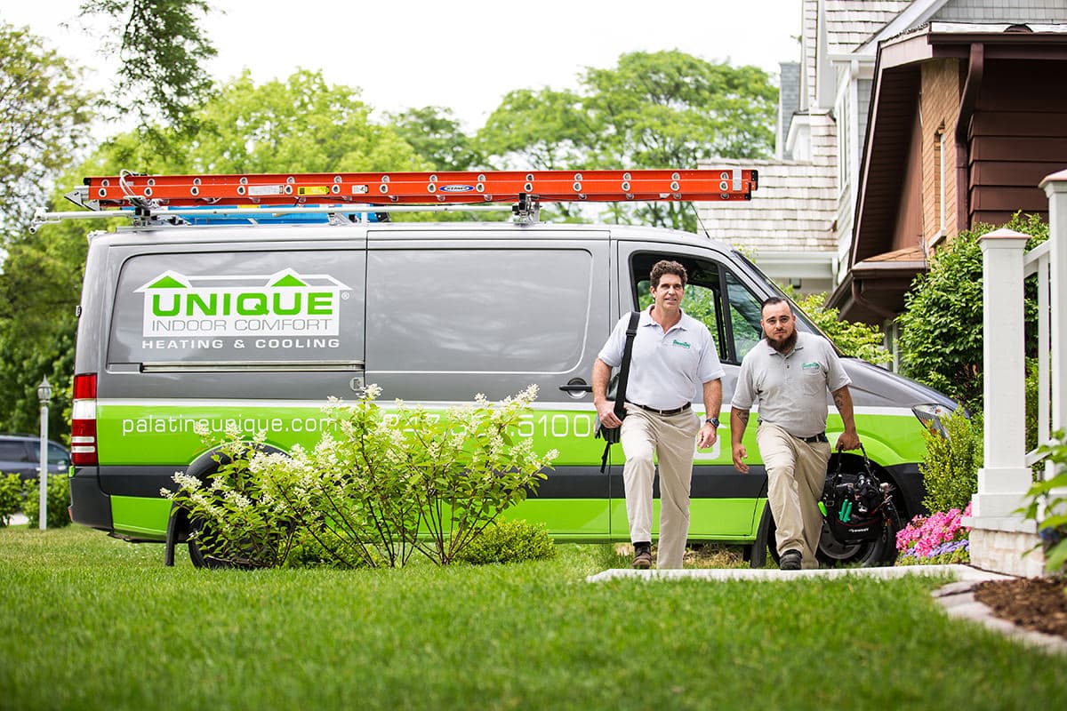 Home repair team walking into a residence to start a project, captured for Chicago business photography to showcase service, professionalism, and teamwork.