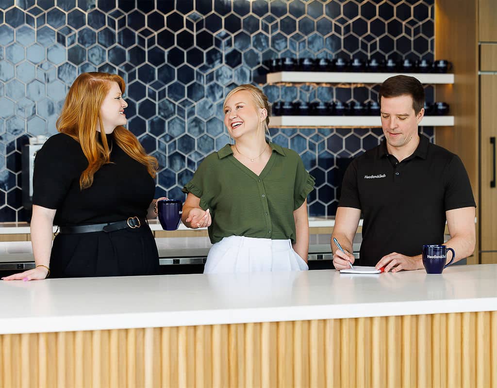 Team collaboration in an office kitchen, showcasing corporate lifestyle photography